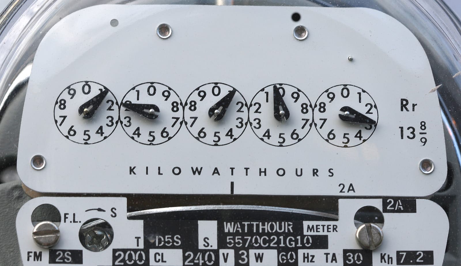 TNS Electric Close-up of an analog electricity meter, ideal for any electrician, showing readings in kilowatt-hours with five numbered dials and various technical specifications below.