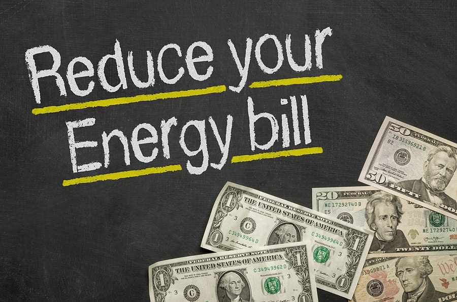 TNS Electric Chalkboard with the phrase "Reduce your Energy bill" highlighted, alongside various US dollar bills at the bottom—perfect inspiration for anyone considering an electrician’s expert advice on saving energy and cutting costs.